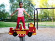 Child in playground in Kane Park