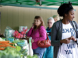 Photo of people shopping for vegetables at the Gresham Farmers' Market