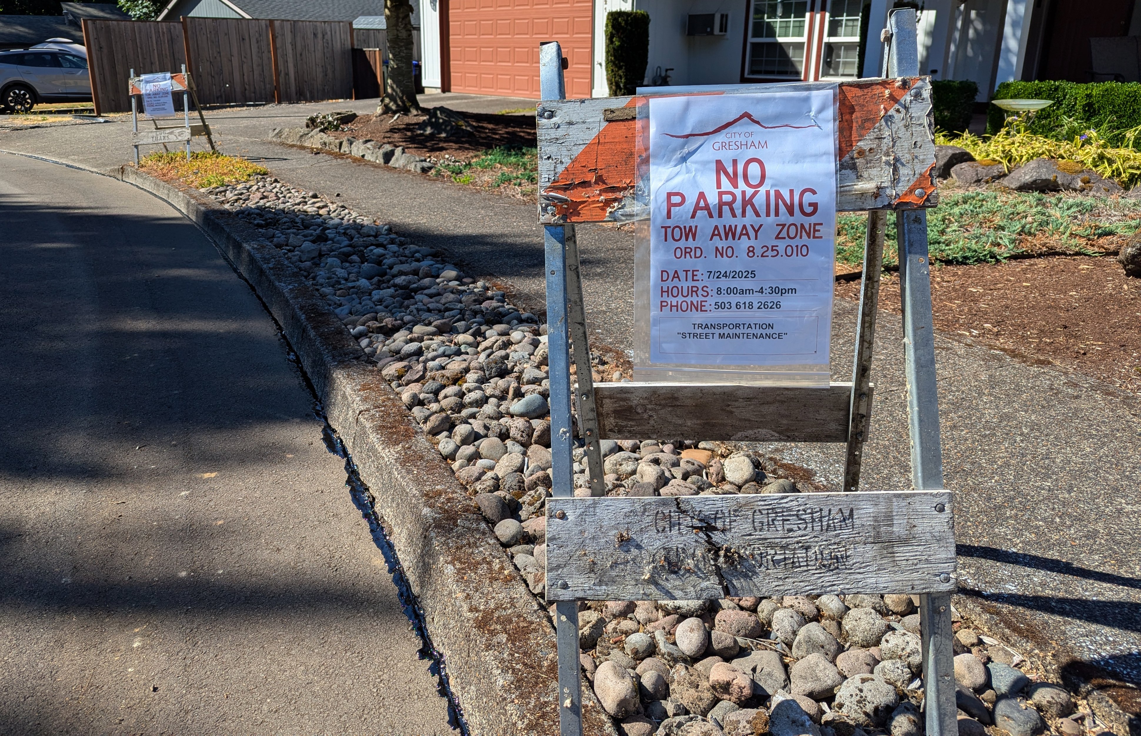 A no parking sign on a residential street.