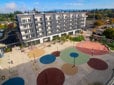 An overhead view of the five-floor AVIVA Apartments next to the Rockwood Market Hall at the Downtown Rockwood community hub.