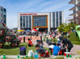 Families gather to enjoy the playground and splash pad on the Downtown Rockwood community plaza.