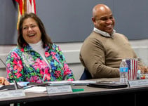 City Councilor Sue Piazza shares a laugh with Gresham Mayor Travis Stovall.