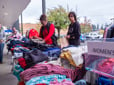 A table with folded women's clothing - free to the community. 